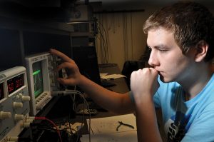 electronic student working at a switchboard