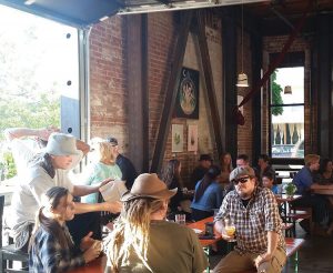 patrons enjoying a meal and a brew inside the Haul