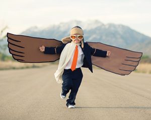 boy with wings on a road