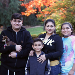 Juliette Antolin poses for a photo with her children.