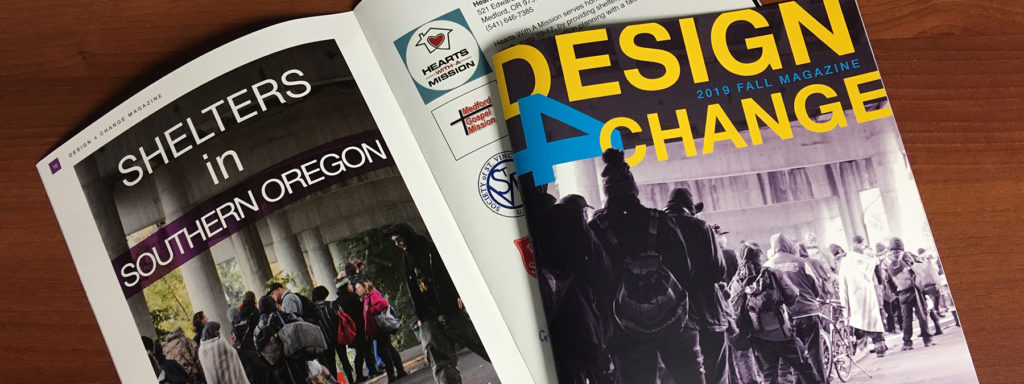 Two copies of Design 4 Change magazine lay on a table