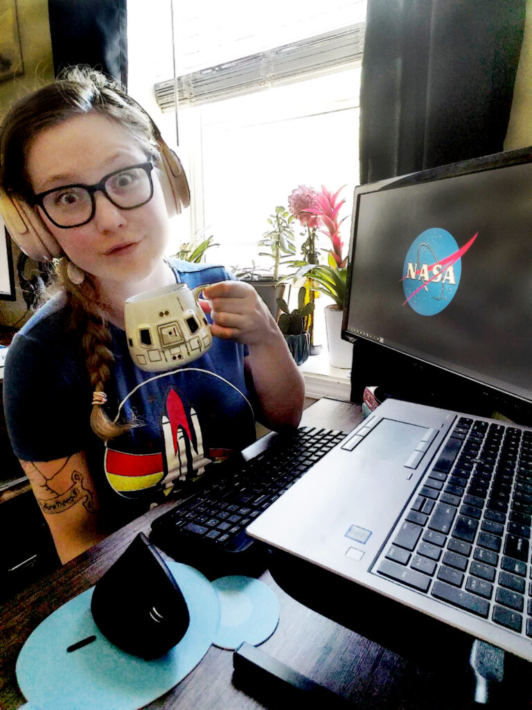 Portrait of Rowan Parker sitting at a computer.