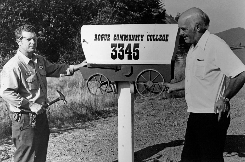RCC’s first president Henry Pete (right) and Robert Duesslier, a carpenter and maintenance worker,
erect a mailbox near Redwood Highway at the entrance to the new community college.