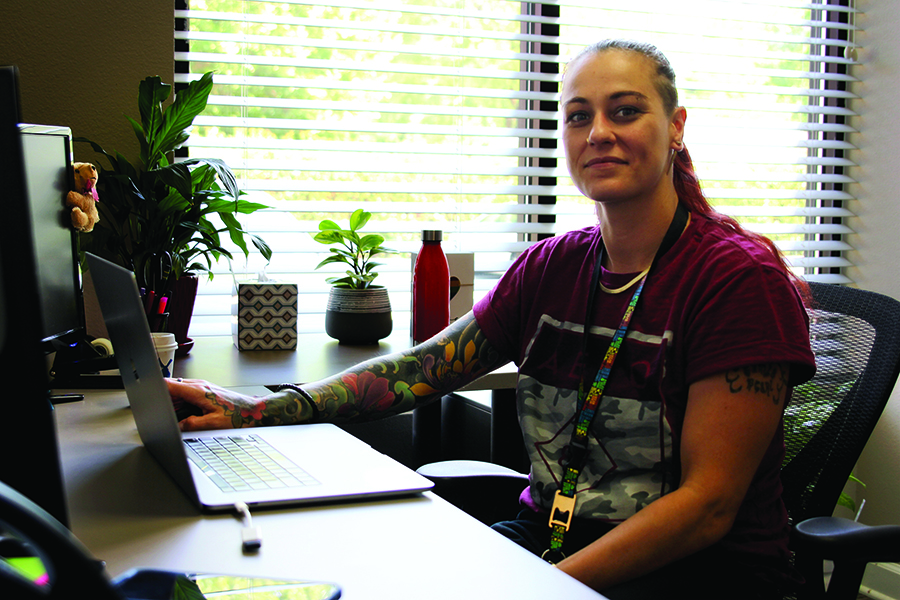 Portrait of Camille Ireland using a laptop computer.