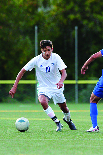 A picture of Rosendo Juarez Flores, who goes by Pizo, playing soccer.