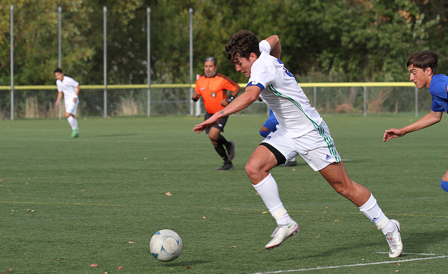 Jhoel Sarraude chases after the ball in a 2021 match at Rogue Community College.