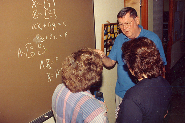 Rogue Community College math instructor 'Doc' Holliday explains a math formula, circa 1993.
