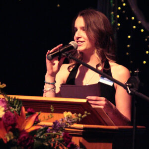 honors night student giving speech at podium